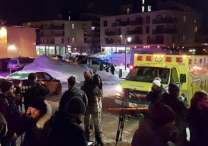 An ambulance is parked at the scene of a fatal shooting at the Quebec Islamic Cultural Centre in Quebec City